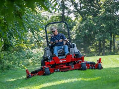 Man mowing his lawn with a 2018 Exmark Lazer Z Diesel LZS88CDYM604W0